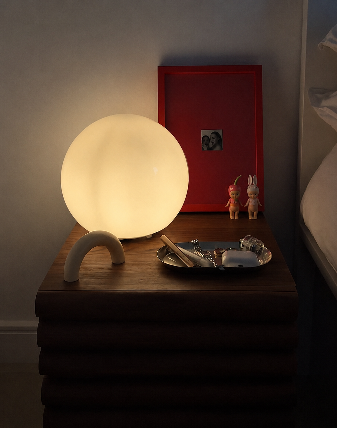 Evening light — the Arc on a bedside table